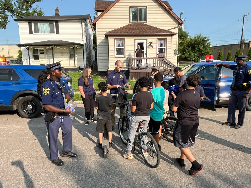 Police giving bikes to children