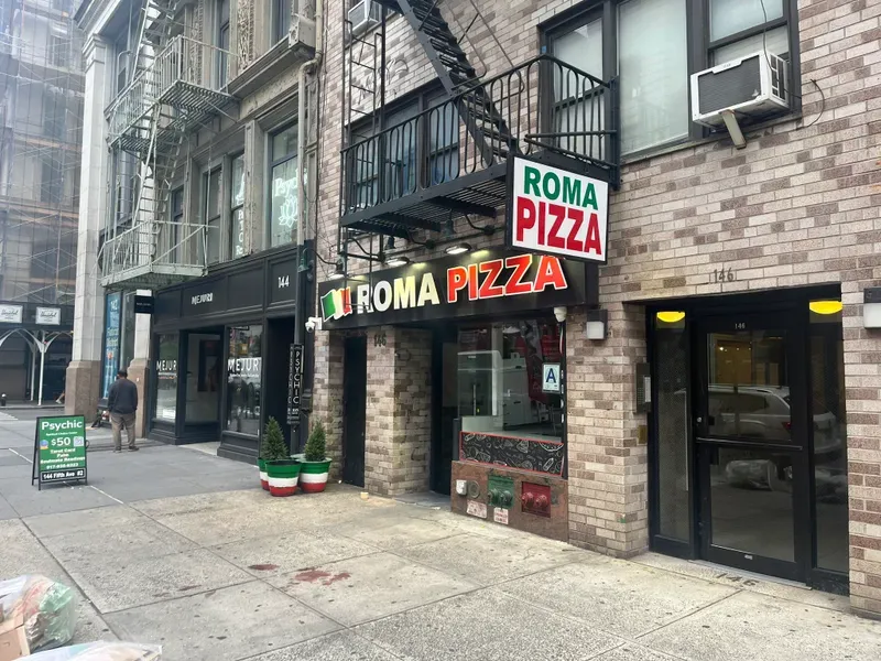 Blood was still on the sidewalk outside Roma Pizza a day after a brutal attack on the manager on Aug. 19, 2024. 