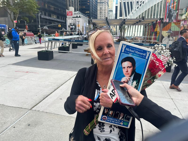 Diane Massaroli holds a photo of her late husband, Michael Massaroli, who was killed in the North Tower