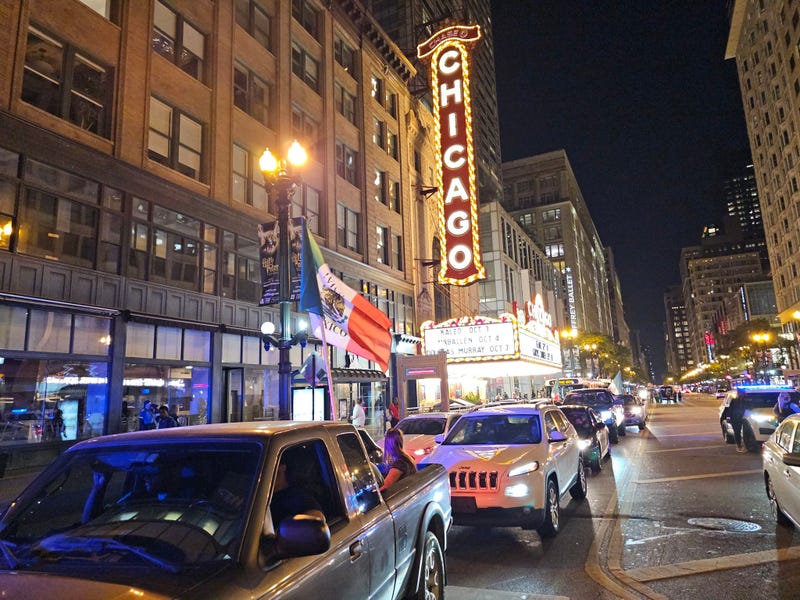 Cars travel on State Street Sunday night
