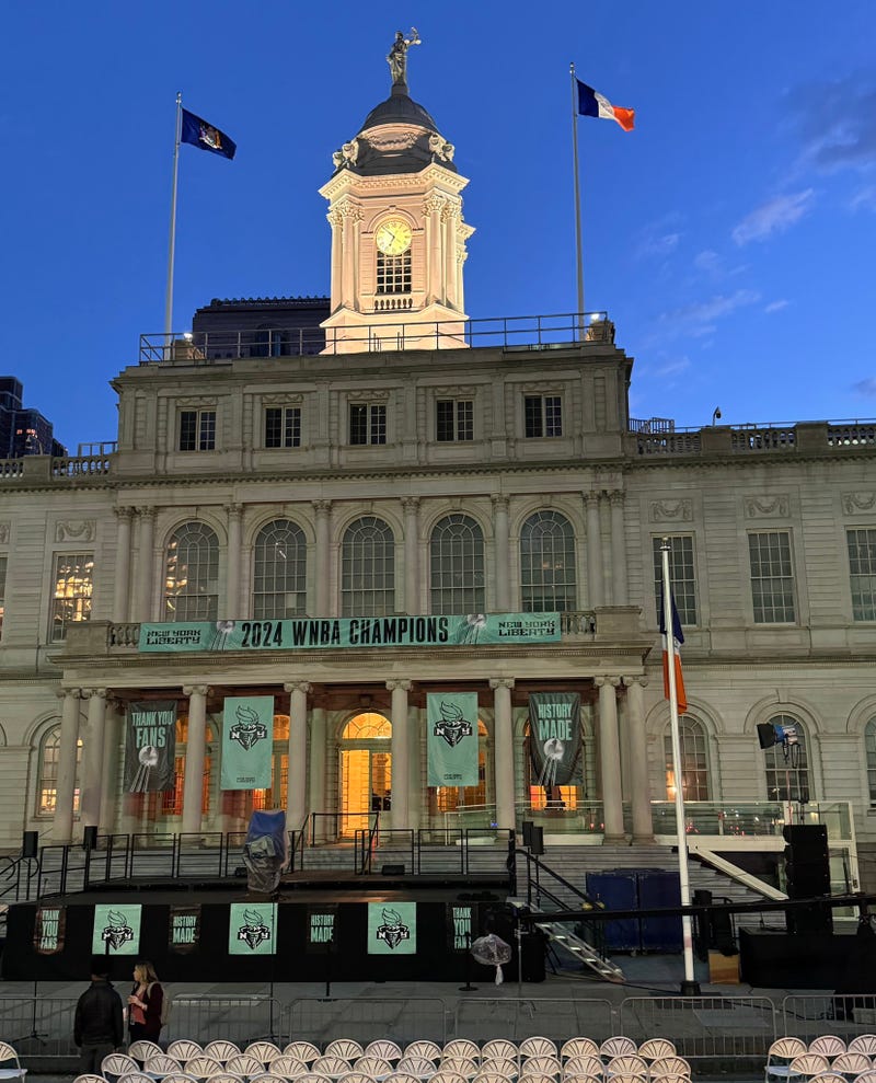 City Hall is seen in New York Liberty decorations at sunrise Thursday