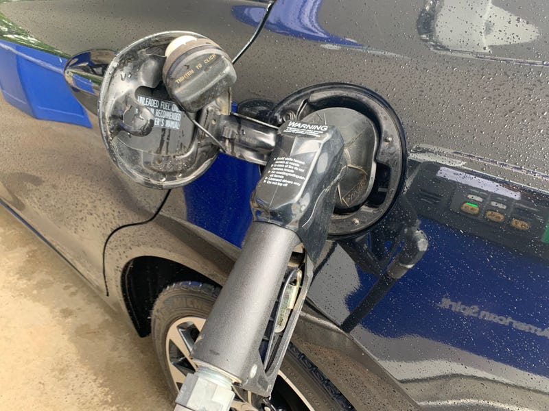 Car refueling at upstate gas station.