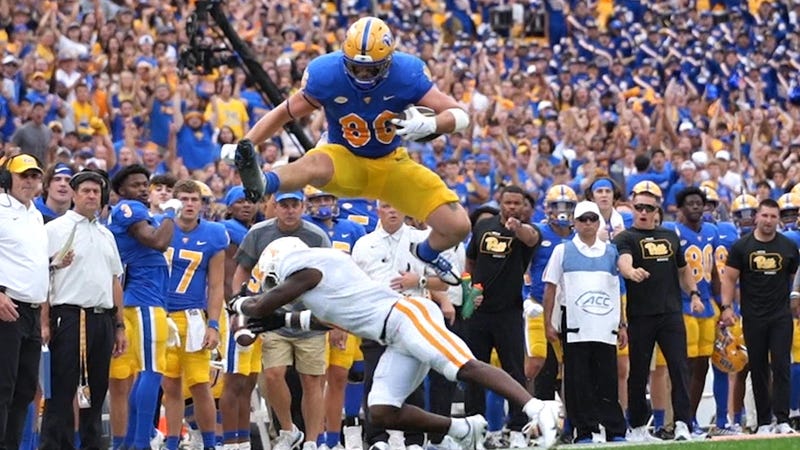 Gavin Bartholomew leaping a defender for a TD