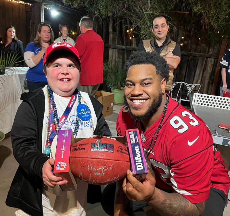 Gavin from St. Louis takes in some Super Bowl week festivities with NFL players prior to the big game on Sunday
