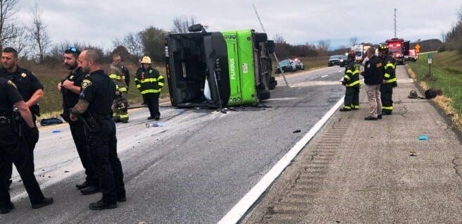 A tour bus flipped over on I-490 west of Rochester on Nov. 7, 2024. 