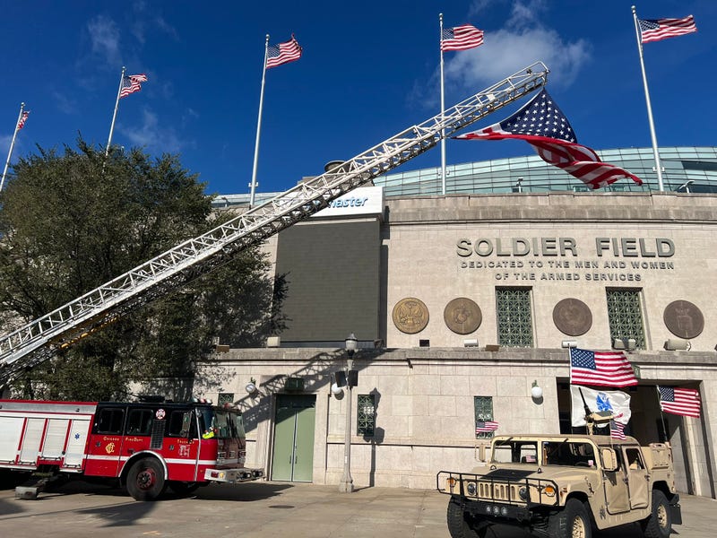 A U.S. flag hangs from a Chicago Fire Department ladder outside Soldier Field on Nov. 11, 2024, for a Veteran's Day commemoration.