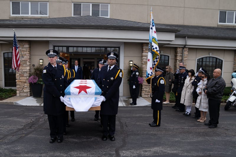 A casket carrying fallen Chicago Police Officer Enrique Martinez is taken from Blake-Lamb Funeral Home to St. Rita of Cascia Catholic Church, where funeral services took place on Nov. 18, 2024.