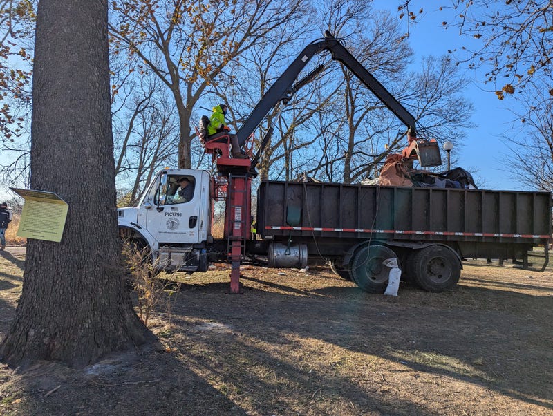 City of Chicago truck removes tent from Humboldt Park