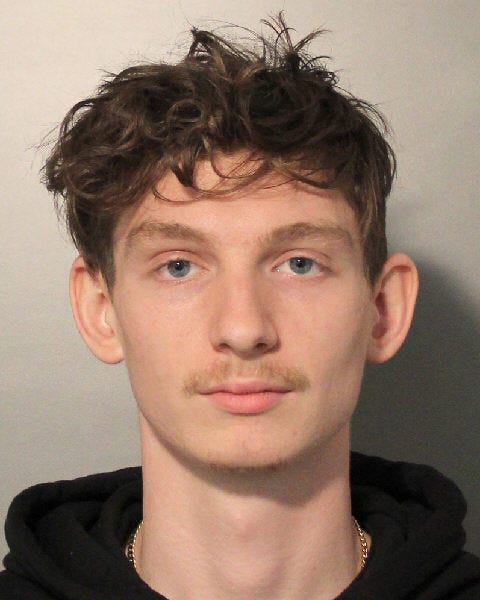 Gerald Gilraine, 21, is facing several charges after he accidently shot himself in the hand and police found two illegal "ghost guns."