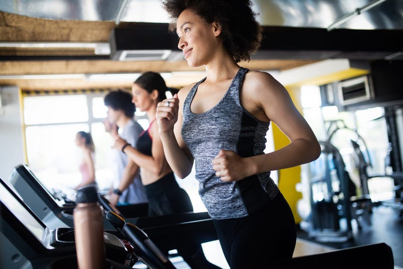 woman running on treadmill