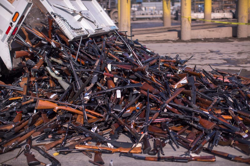 RANCHO CUCAMONGA, CA - JULY 19: A truck dumps approximately 3,500 confiscated guns to be destroyed into a pile at Gerdau Steel Mill on July 19, 2018 in Rancho Cucamonga, California. The weapons were seized in criminal investigations, probation seizures and gun buyback events, and will be recycled into steel rebar for the construction of highways and bridges. (Photo by David McNew/Getty Images)