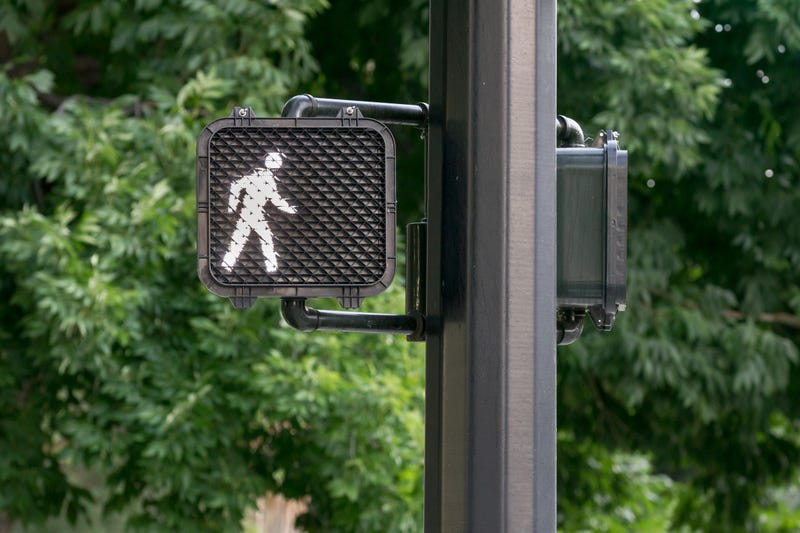 Pedestrian signal at crosswalk