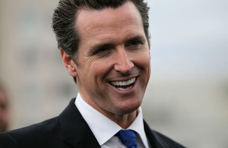 Gov. Gavin Newsom smiles during a news conference in San Francisco, California.