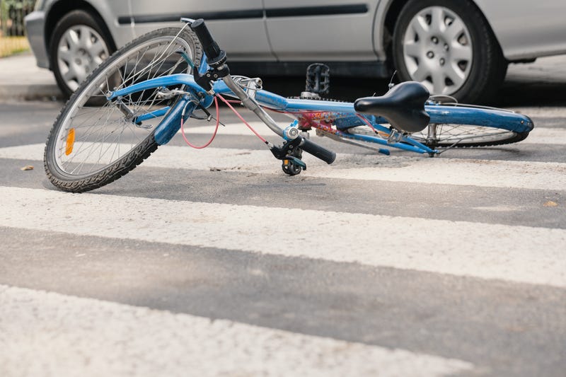 Two people are dead in St. Clair County after a car hit a bicyclist and another vehicle hit a 40-year-old woman who attempted to help, police said.