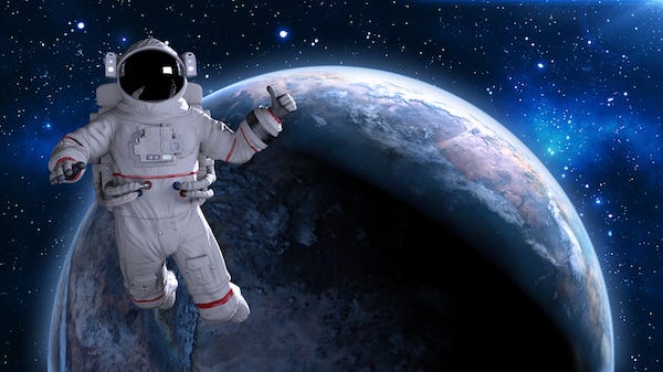Astronaut in space giving thumbs up