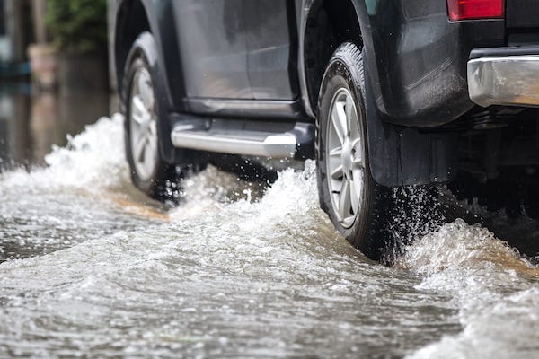 Car driving on a flooded street
