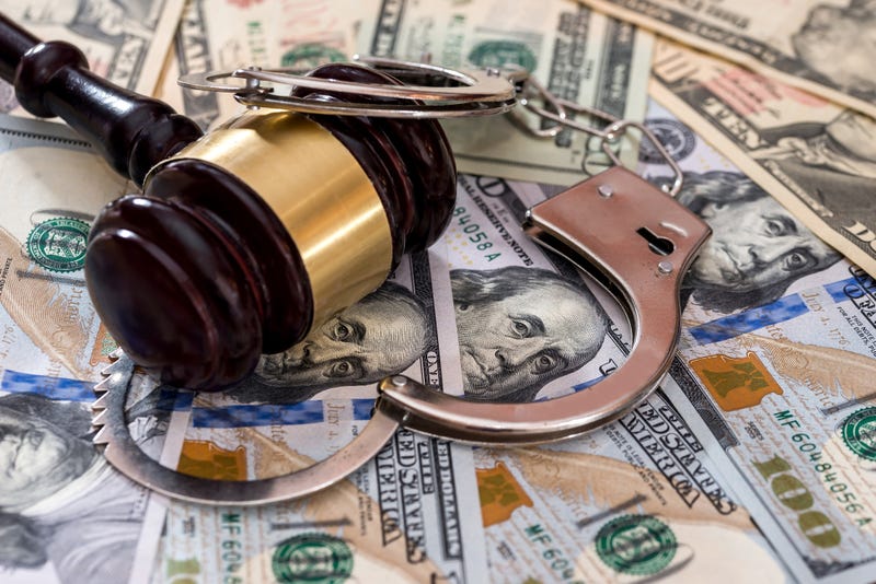 Money, gavel and handcuffs