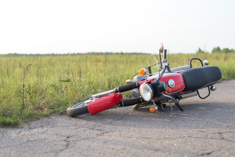 Crashed motorcycle on rural road