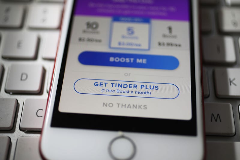 In this photo illustration, the dating app Tinder is seen on the screen of an iPhone on August 14, 2018 in Miami, Florida.