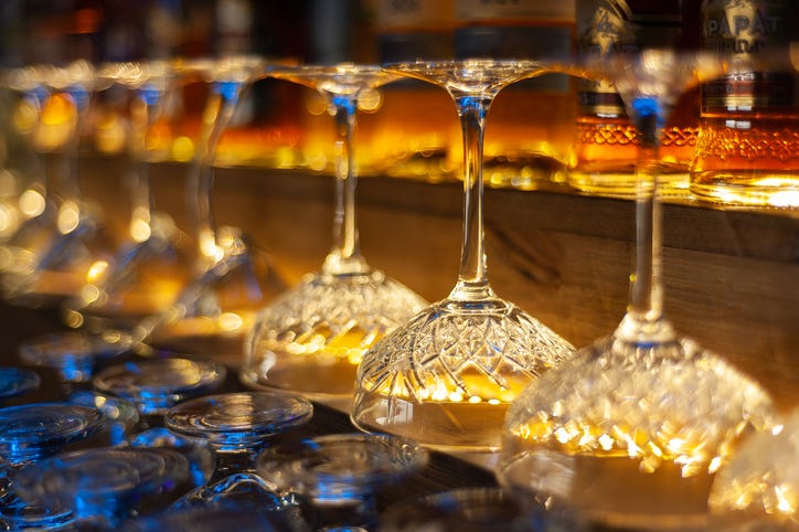 Glass row bar counter . Many empty wineglasses