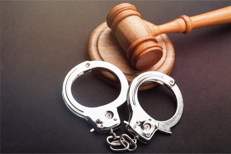 Gavel and handcuffs stock photo.