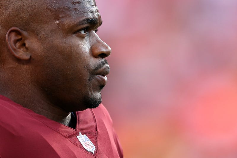 Running back Adrian Peterson #26 of the Washington Commanders looks on before playing the Denver Broncos during a preseason game at FedExField on August 24, 2018, in Landover, Maryland.
