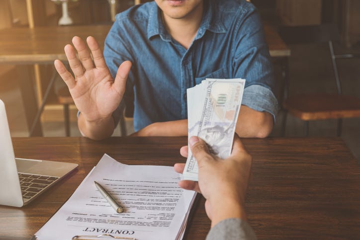 Man being offered money