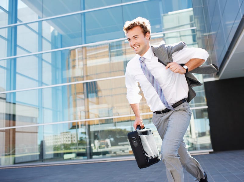 Businessman leaving work for the weekend. 