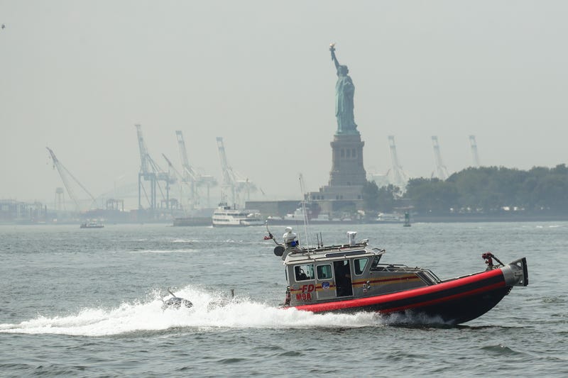 An FDNY boat (not the specific boat involved in the crash) cruises through New York Harbor.