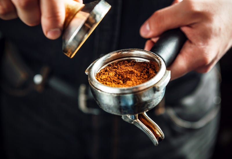 barista holds espresso