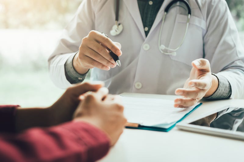 person talking with doctor