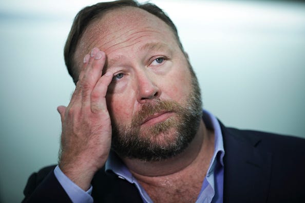 Alex Jones of InfoWars talks to reporters outside a Senate Intelligence Committee hearing concerning foreign influence operations' use of social media platforms, on Capitol Hill, September 5, 2018 in Washington, DC. 