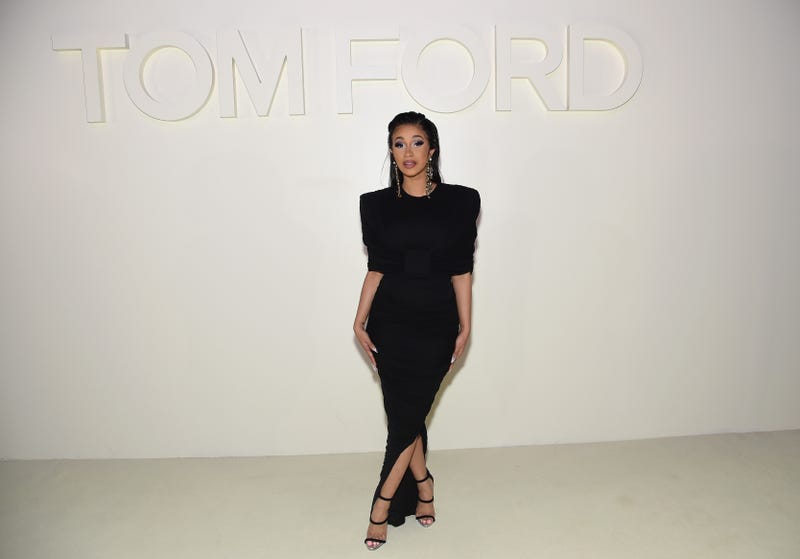 cardi b poses in a classic sleek black dress at the tom ford show on new york fashion week
