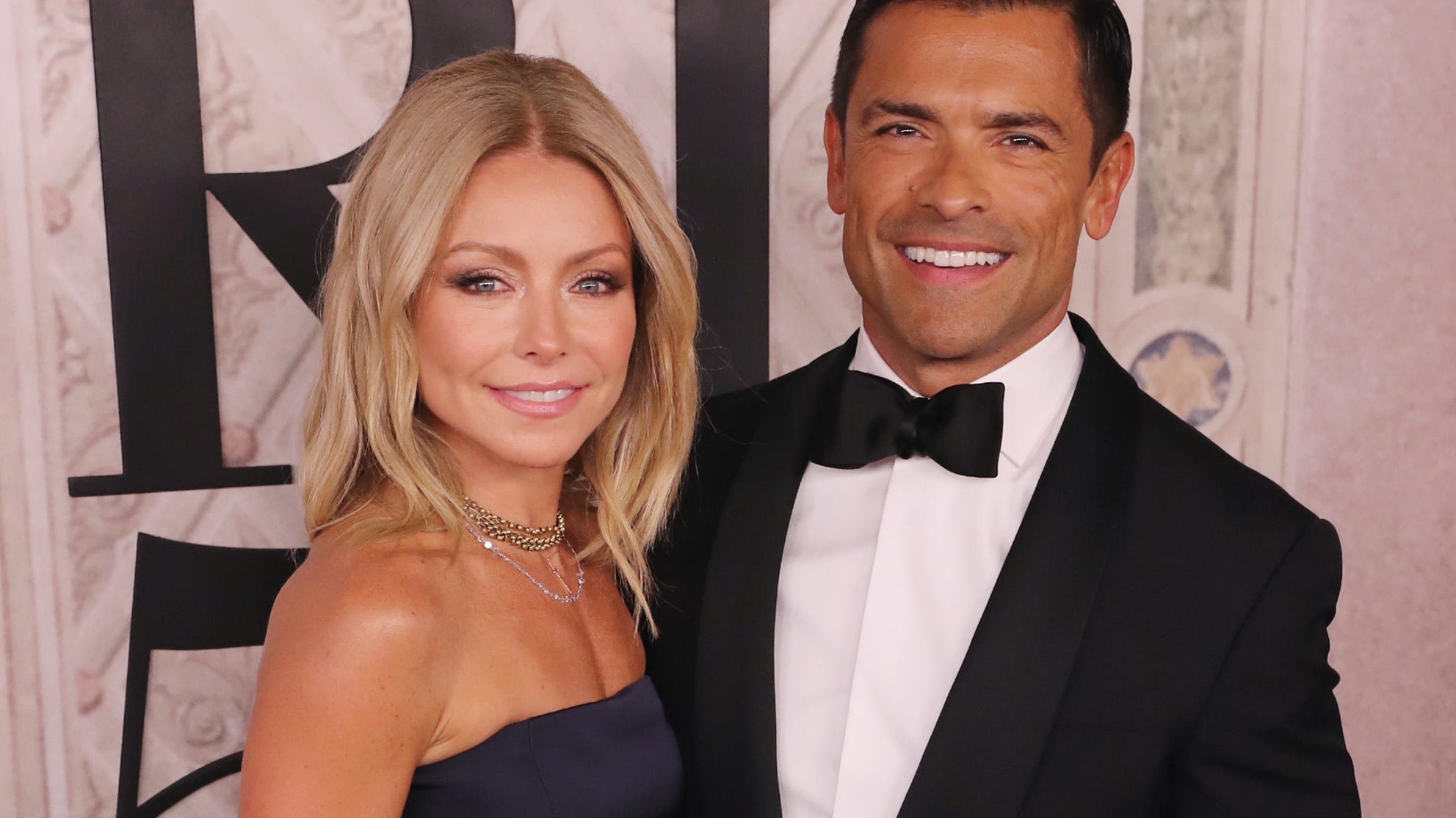 Kelly Ripa shares flirty swimsuit selfie with shirtless husband Mark Consuelos
