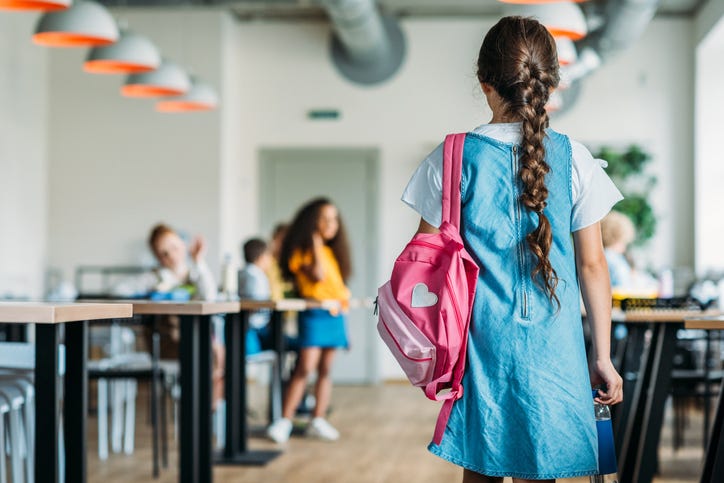 girl in school cafeteria