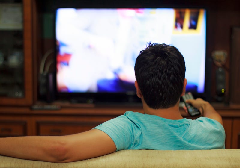 Man watching sports on TV