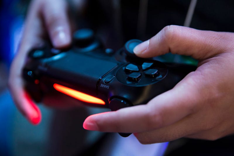 An attendee plays a video game on the PlayStation 4 video game console in the Sony Interactive Entertainment booth during the Tokyo Game Show 2018 on September 20, 2018 in Chiba, Japan. The Tokyo Game Show is held from September 20 to 23, 2018. (Photo by Tomohiro Ohsumi/Getty Images)