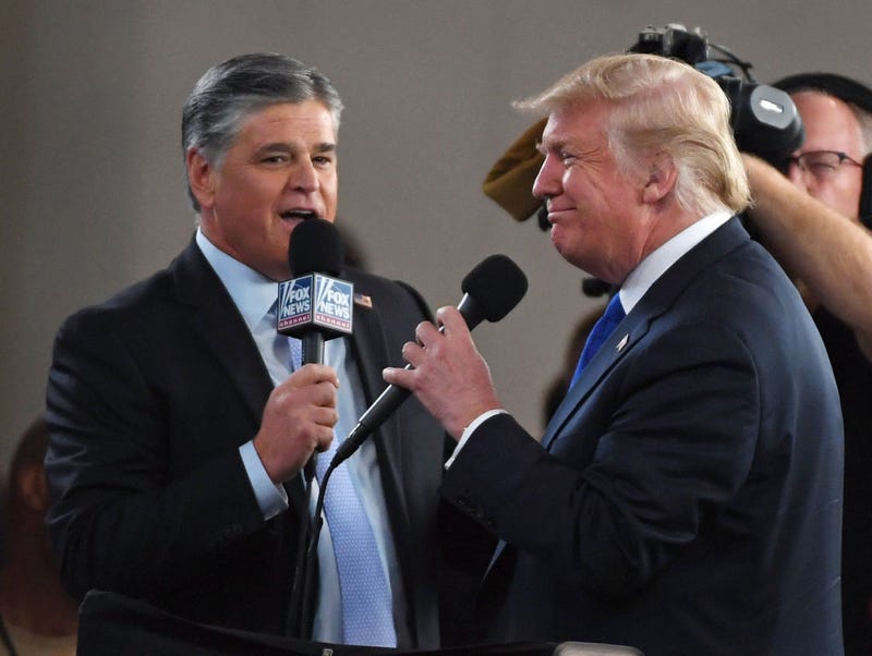 Fox News Channel and radio talk show host Sean Hannity (L) interviews U.S. President Donald Trump before a campaign rally at the Las Vegas Convention Center on September 20, 2018 in Las Vegas, Nevada. 