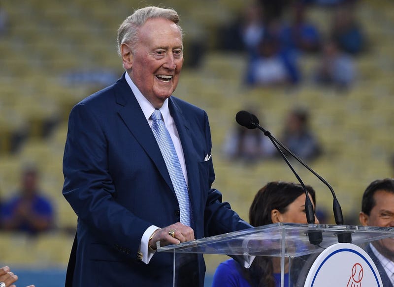 Retired Dodgers broadcaster Vin Scully, left speaks during a pregame ceremony honoring language broadcaster Jaime Jarrin inducting him into the Dodger Stadium Ring of Honor at Dodger Stadium on September 2, 2018 in Los Angeles, California.