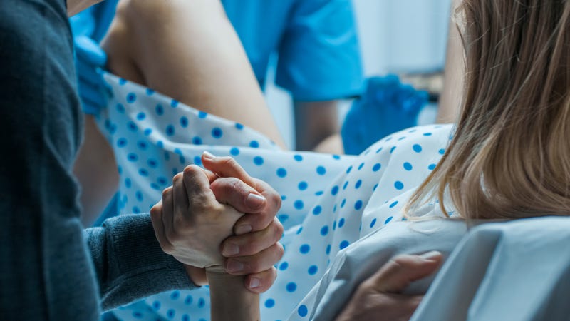 Woman giving birth in hospital