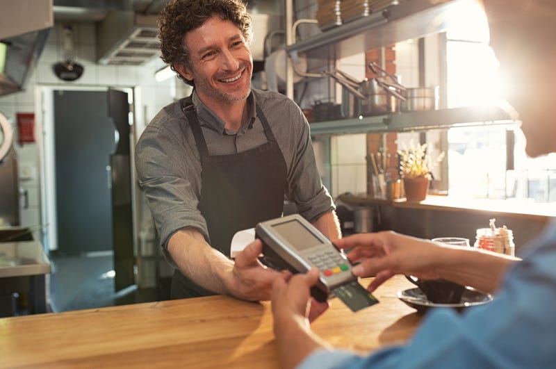 Man paying at a restaurant. 