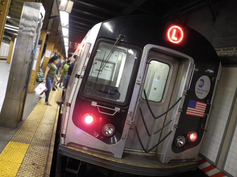 An off-duty NYPD officer was pushed onto subway tracks at the Third Avenue station on the L line on Tuesday night, sources said