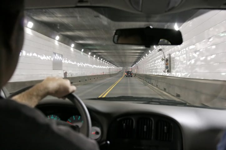 View of the inside of the Detroit Windsor Tunnel, photographed through a car windshield.