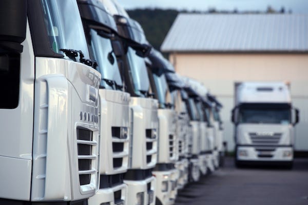 White trucks parked in a parking lot