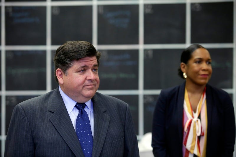 Illinois Governor JB Pritzker stands with Illinois Lieutenant Governor Juliana Stratton