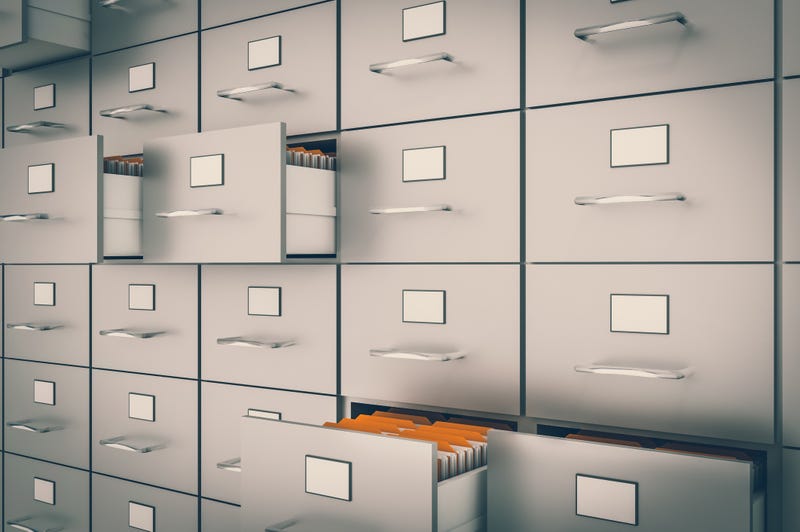 Filing cabinet with yellow folders in an open drawers - data collection concept. 3D rendered illustration.