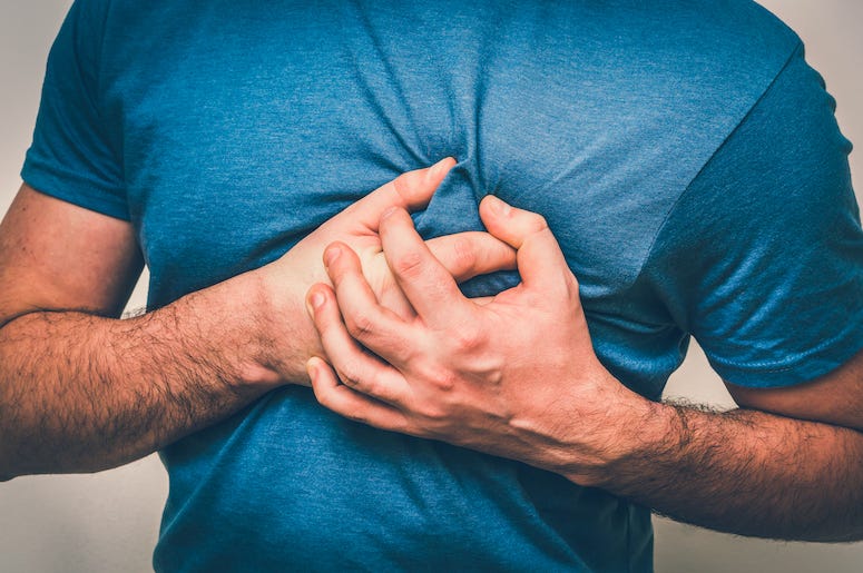 Man holding chest