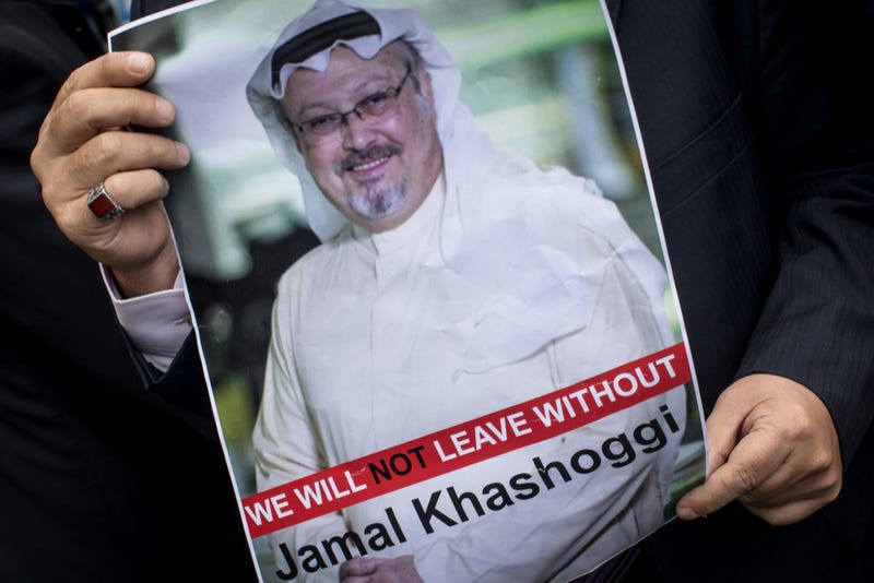A man holds a poster of Saudi journalist Jamal Khashoggi during a protest organized by members of the Turkish-Arabic Media Association at the entrance to Saudi Arabia's consulate on October 8, 2018 in Istanbul, Turkey.