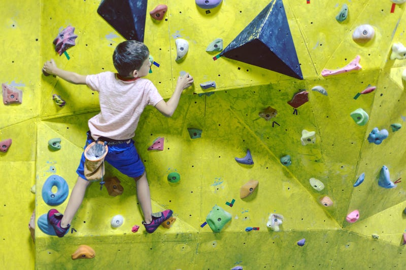 Boy rockclimbing