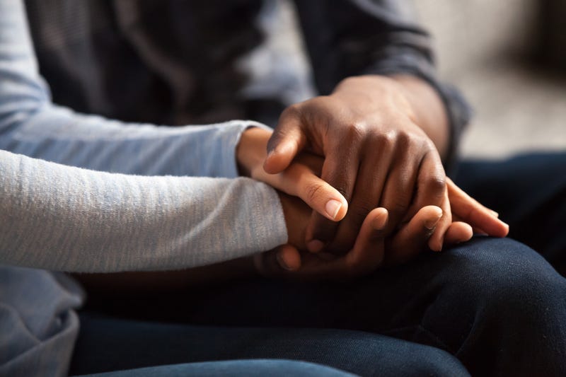 Black couple holding hands 